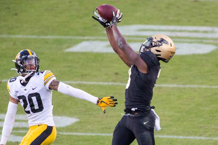 Oct 24, 2020; West Lafayette, Indiana, USA; Purdue Boilermakers wide receiver David Bell (3) catches the ball while Iowa Hawkeyes defensive back Julius Brents (20) defends in the second half at Ross-Ade Stadium. Mandatory Credit: Trevor Ruszkowski-USA TODAY Sports